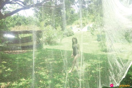 Neo Asian babe in white dress loves feeling her body in water