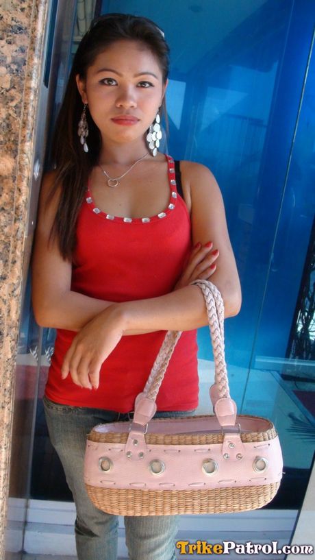 Asian teen Corina strips and shows her small tits and hot ass