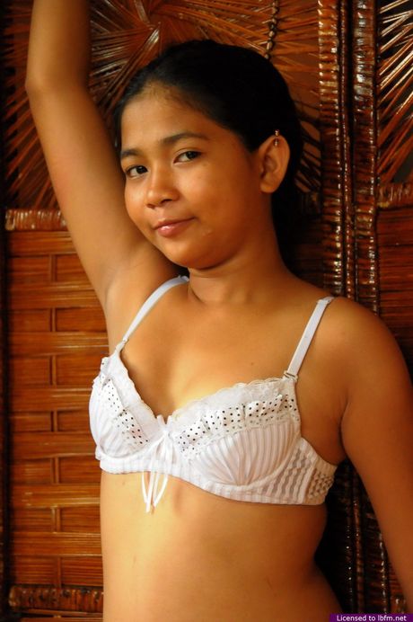 Japanese teenage amateur strips and toys her hairy pussy with a dildo