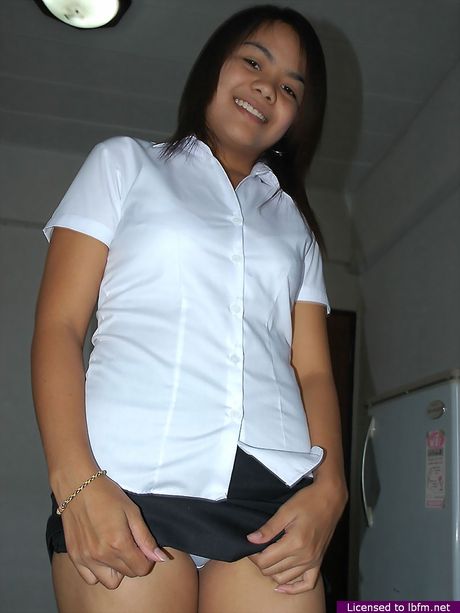 Asian schoolgirl amateur girl strips and shows her hairy cunt up close