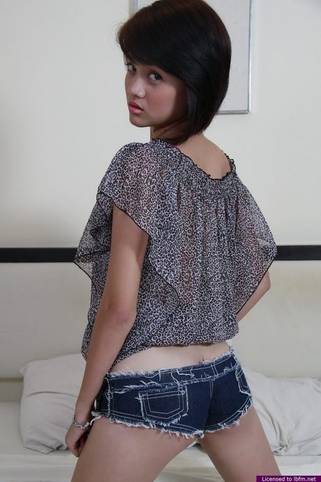 Japanese amateur woman strips off and bares her tiny tits and ass