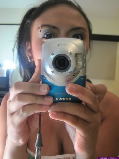 Asian babe with big boobs and ass strips and shows her body