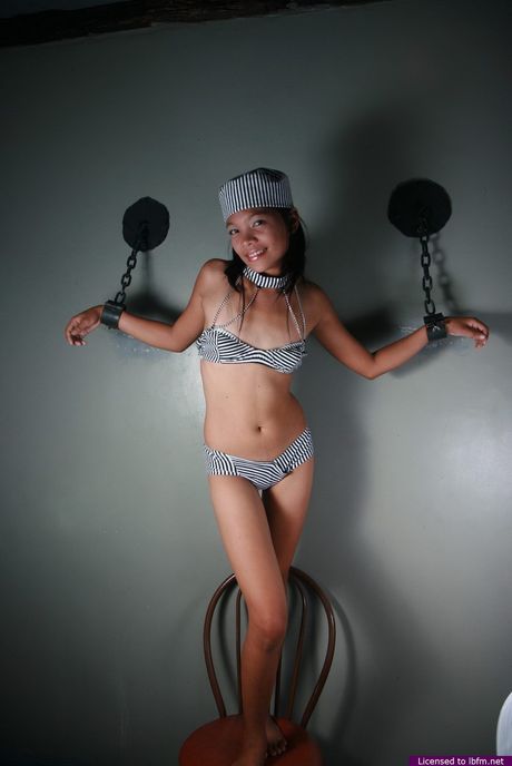 Skinny Japanese teen strips off and reveals her tiny tits and pussy