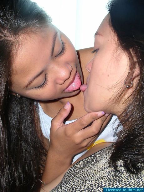 Amateur Asian girls with big melons kissing and licking each others pussies
