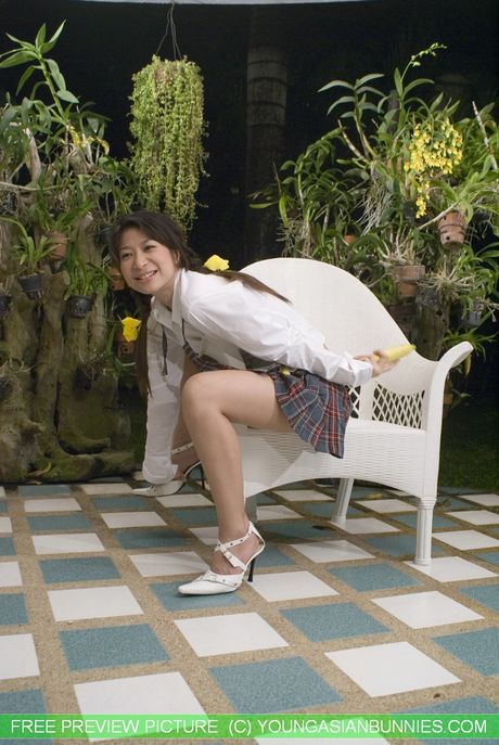 Asian schoolgirl Mekumi strips off and unveils her tiny tits and pussy