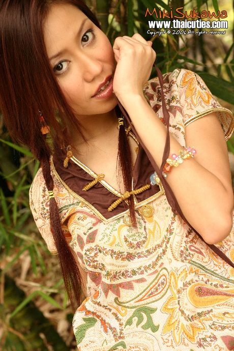 Sexy Asian babe Miki Sukawa strips and shows her tiny tits and pussy