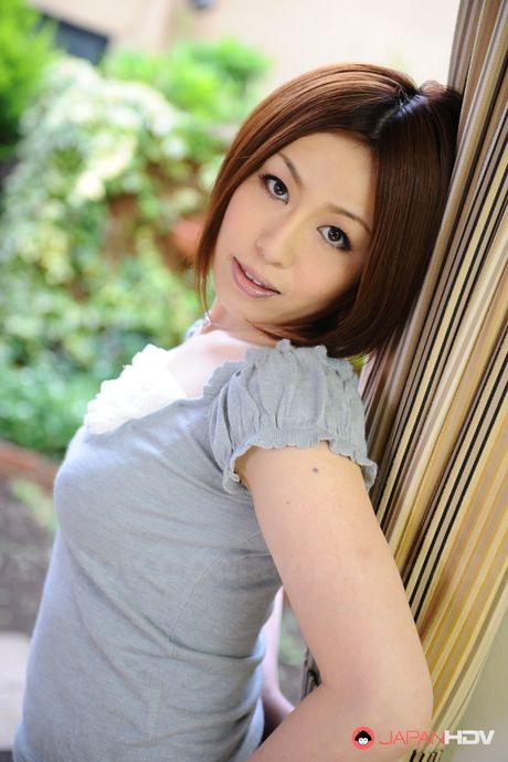 Short haired brunette wife Hiromi Tominaga shows off her body outdoors