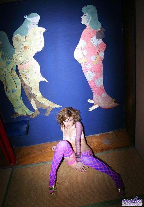 Asian babe Ray Ito strips and shows her tiny tits and ass in a solo