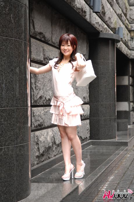 Brunette Japanese babe Hina Kawamura strips and poses nude in the rain