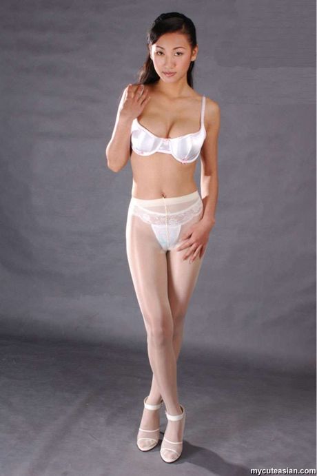 Amateur Asian girl with small tits and a sexy ass strips and reveals her naked form