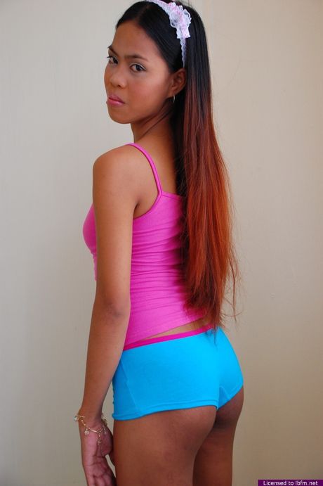 Asian amateur girl with tiny tits and hairy pussy strips and exhibits perfect body